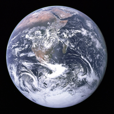 Earth, a vibrant blue planet with swirling white clouds, green landmasses, and vast oceans.