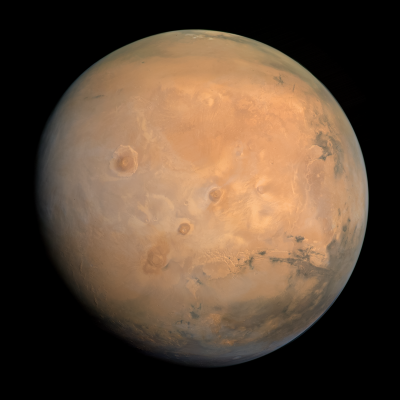 Mars, a reddish-orange planet with dusty terrain, craters, and icy polar caps.